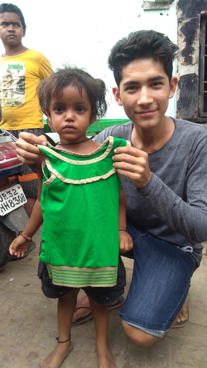 Pradeep bought a dress from Amminabad with his birthday money and gave it to this homeless little girl.